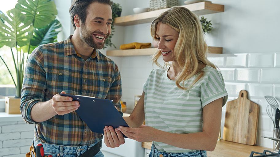 A service professional going over an estimate with a homeowner