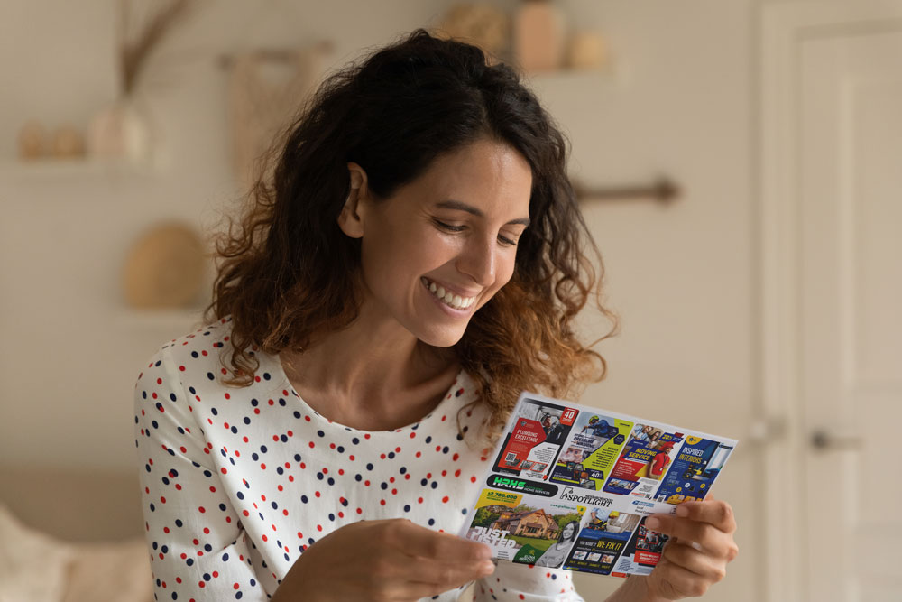 woman holding postcard mockup