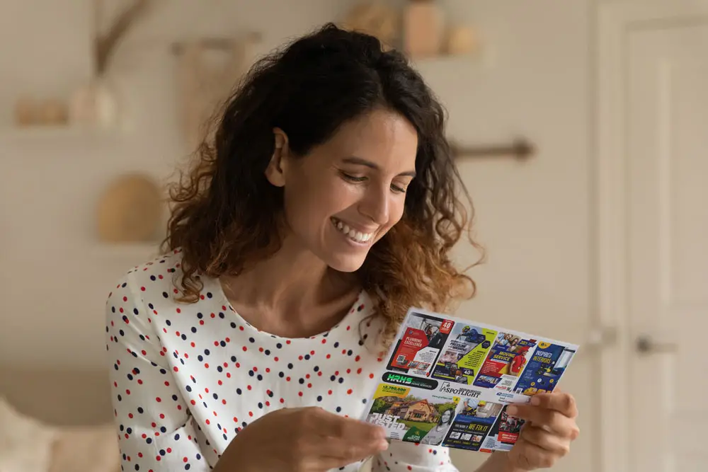 woman holding postcard mockup